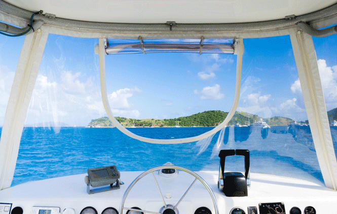 view of blue water and island from inside a boat